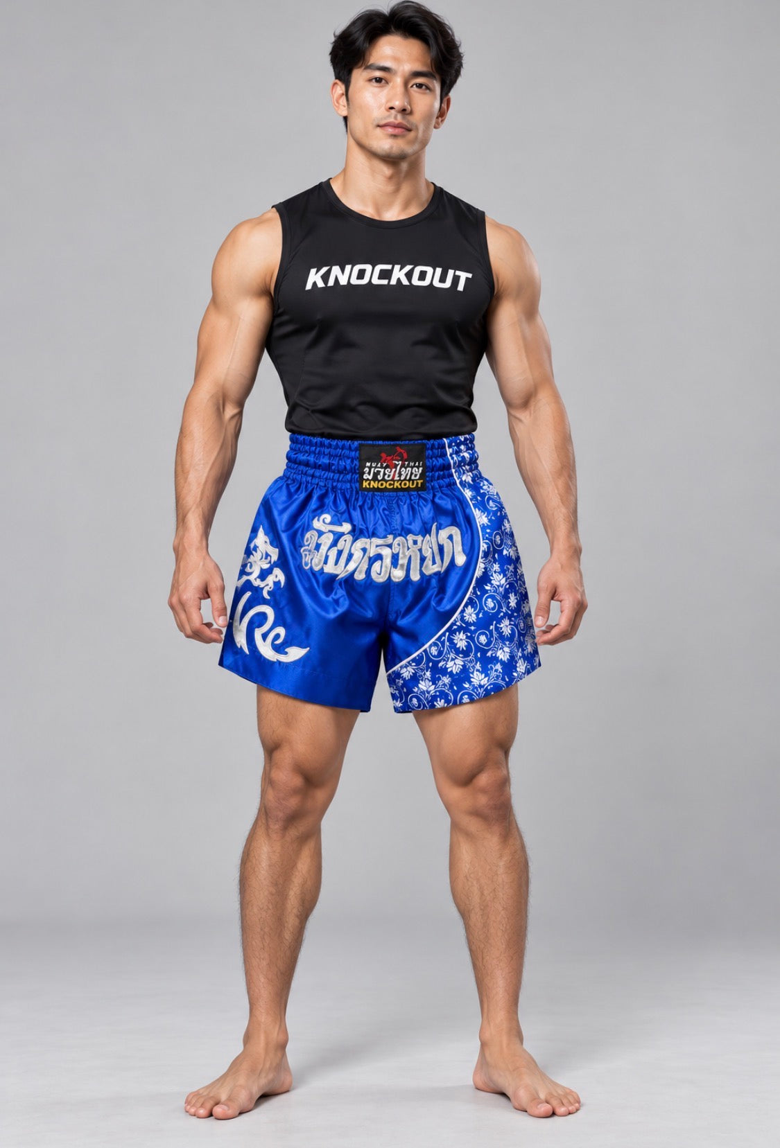 Knockout Muay Thai Blue patterned shorts on model