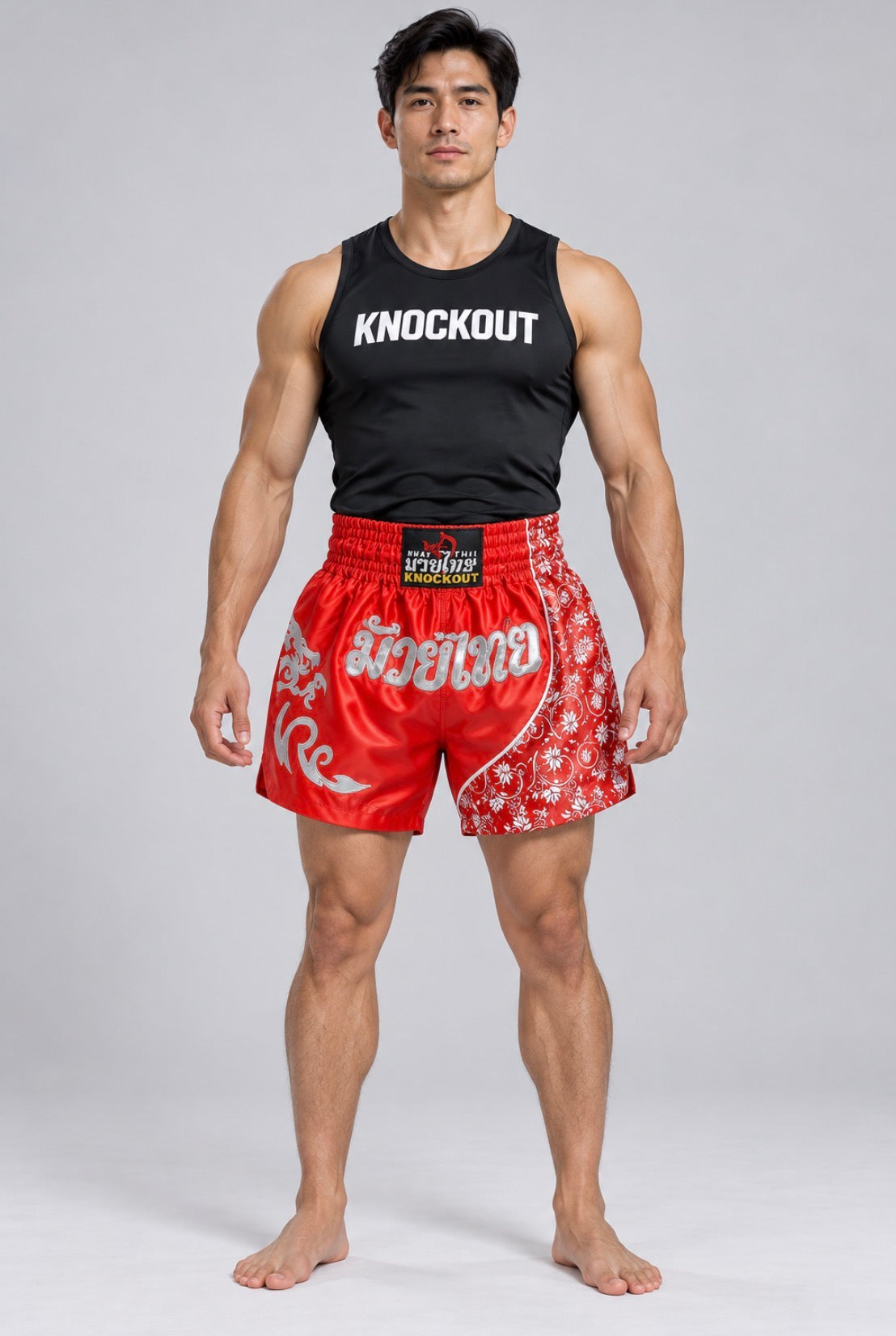 Knockout Muay Thai Red patterned shorts on model