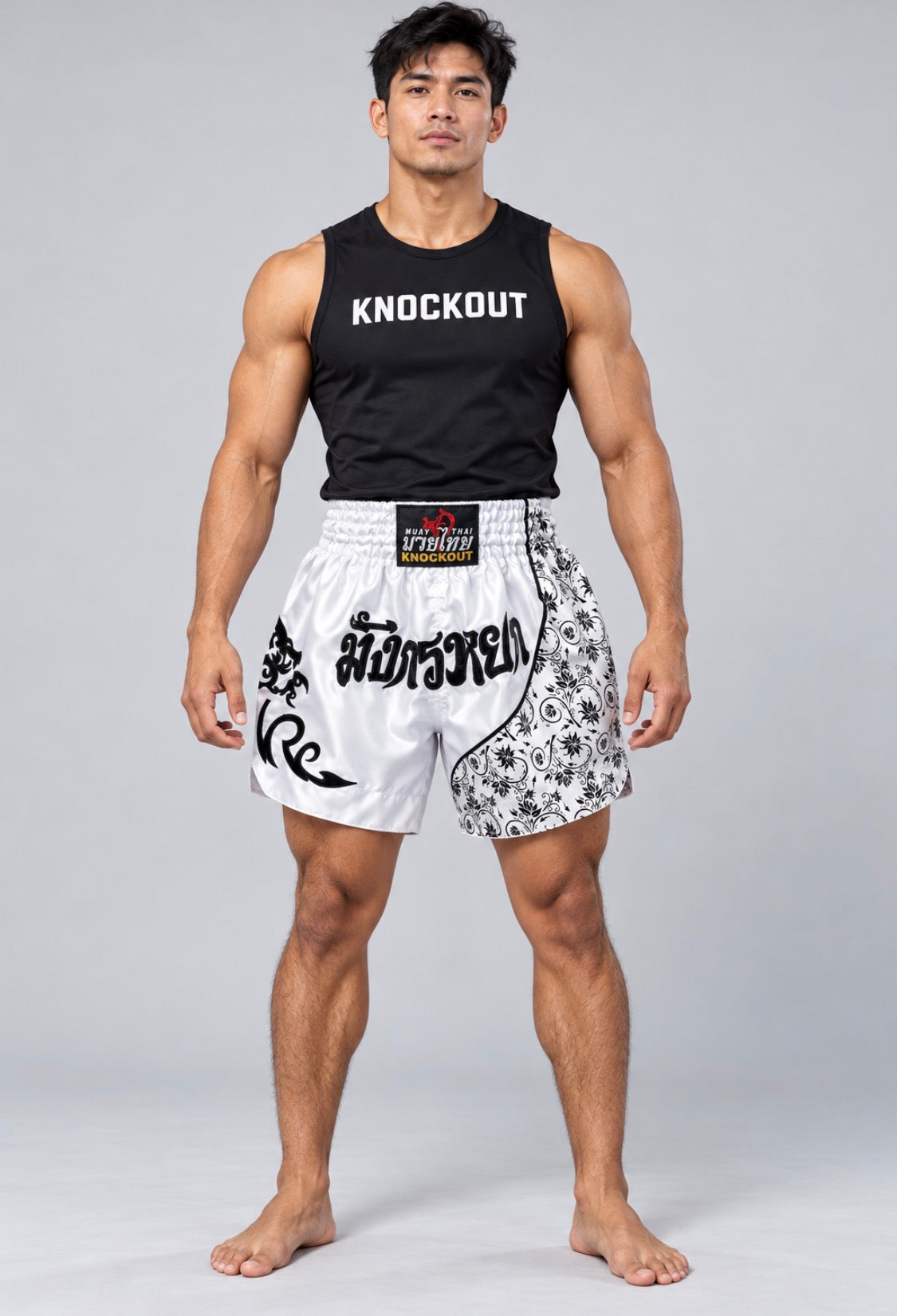 Knockout Muay Thai White patterned shorts on model